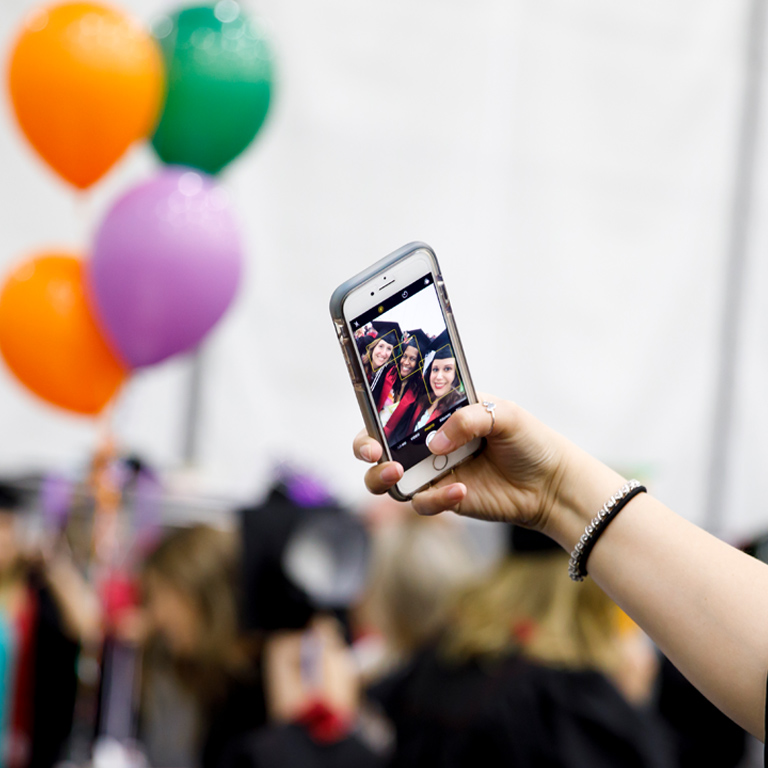 Three female graduates snap a selfie
